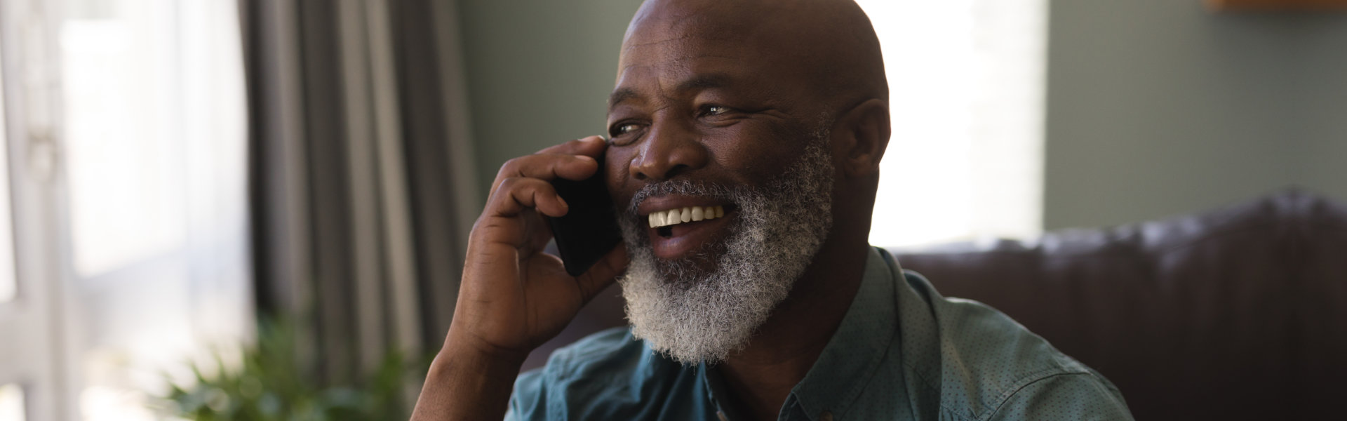 elderly calling from his phone