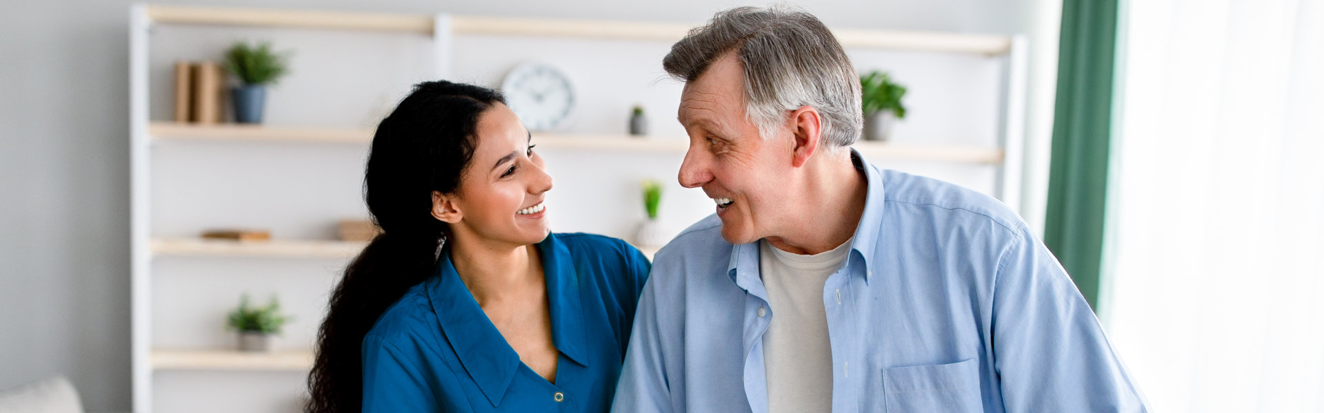 lady and elderly man looking at each other