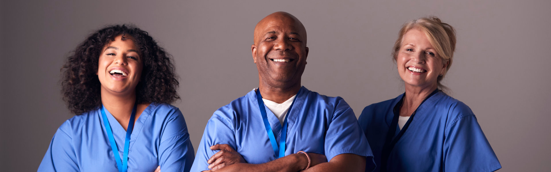 Three health workers smiling