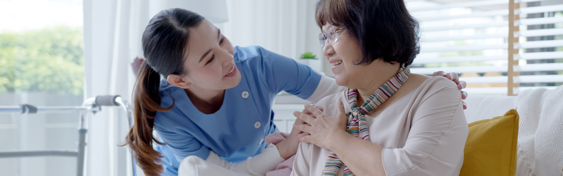 lady tapping the shoulder of elderly